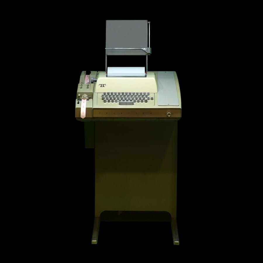 Museum photograph of an ASR-33 teletype terminal.