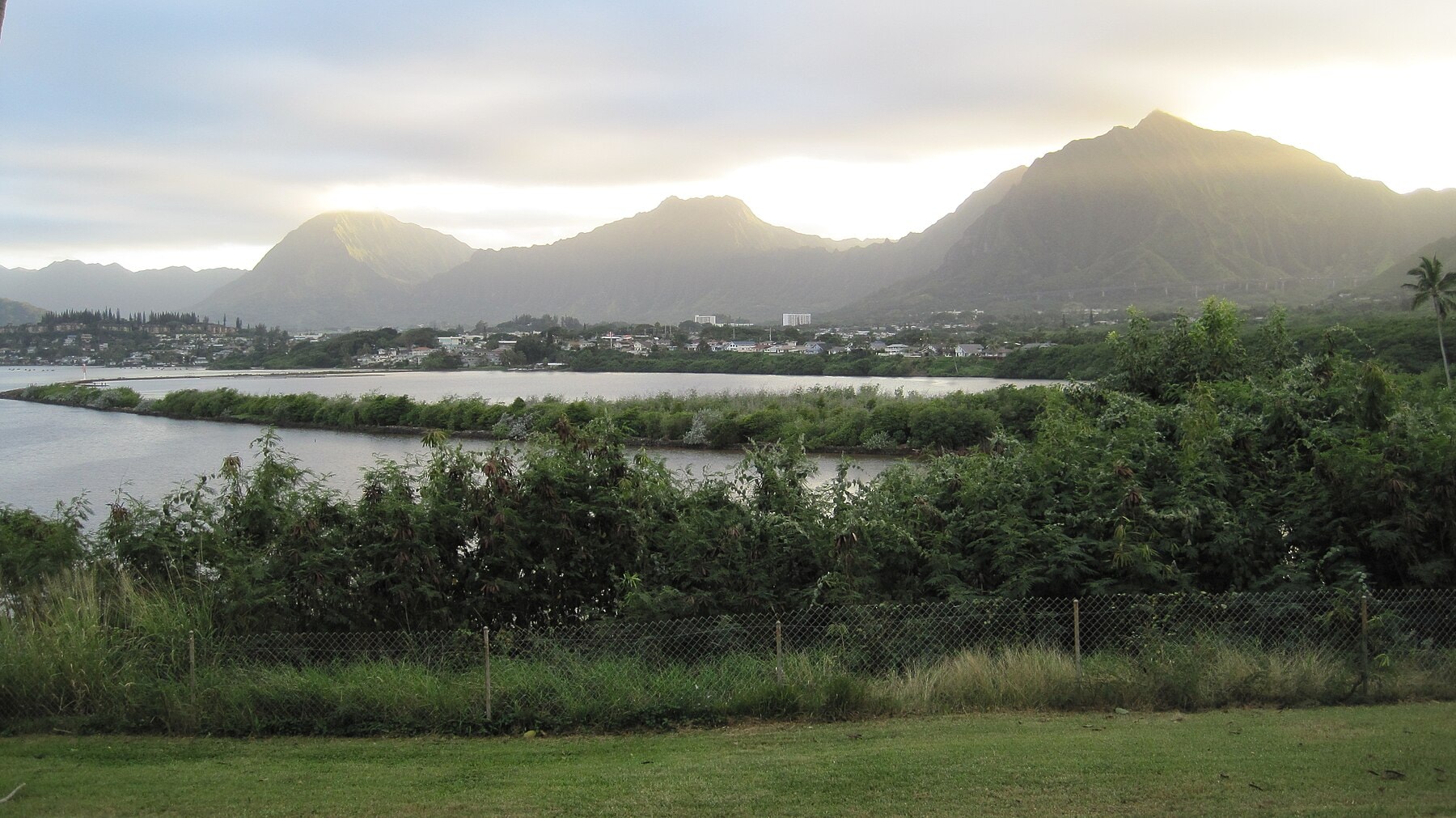 Wide view across Heʻeia fishpond toward the Koʻolau mountains.