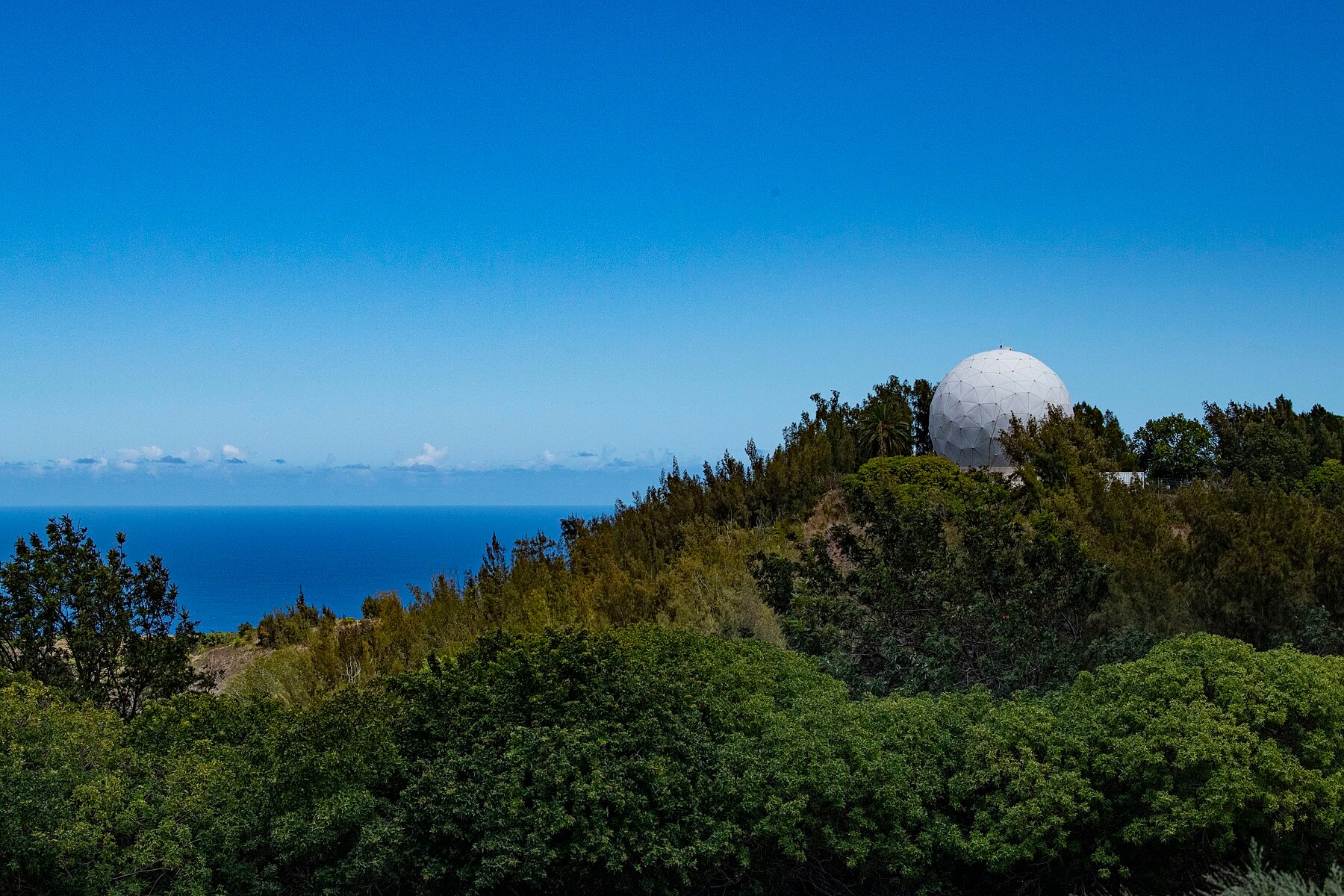 Large white tracking radome at Kaʻena Point.