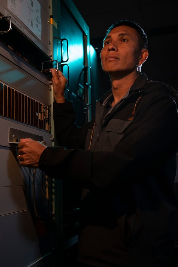 Photograph of a satellite tracking control room.